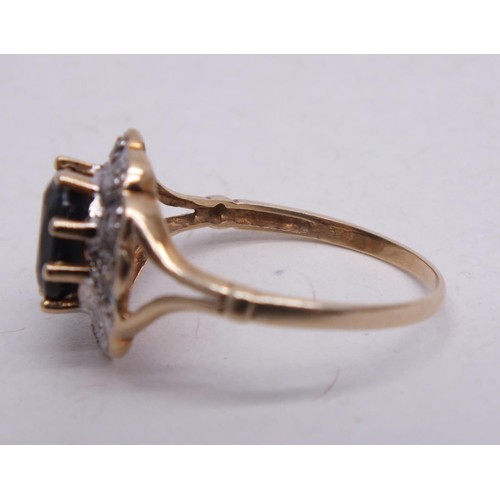 317 - 9CT GOLD RING LARGE SAPPHIRE AND DIAMONDS