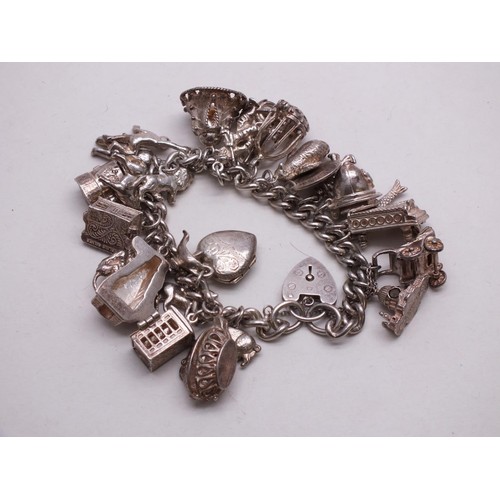 344 - SILVER CHARM BRACELET WITH 25 CHARMS INCLUDES OPENING CHARMS