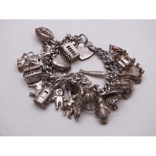 344 - SILVER CHARM BRACELET WITH 25 CHARMS INCLUDES OPENING CHARMS