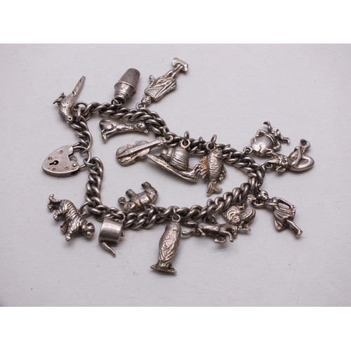 353 - SILVER CHARM BRACELET WITH 16 CHARMS - 59g