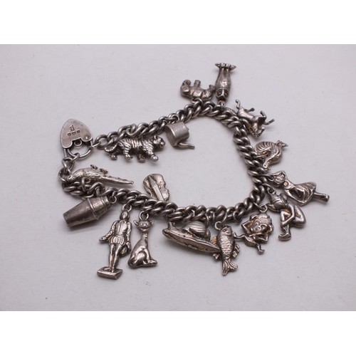 353 - SILVER CHARM BRACELET WITH 16 CHARMS - 59g