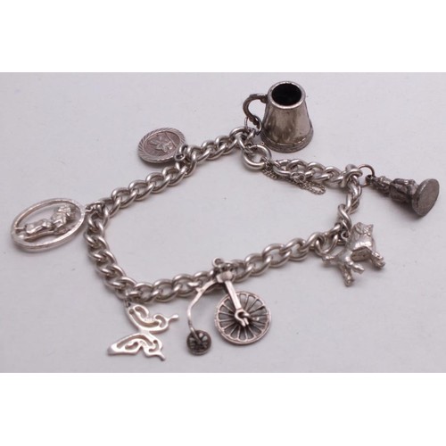 372 - 2 x SILVER CHARM BRACELETS - 56g