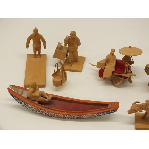 391 - BOX OF HAND CARVED WOODEN ORIENTAL FIGURES