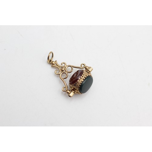 450 - 9ct gold bloodstone, carnelian & onyx spinner fob (3.4g)