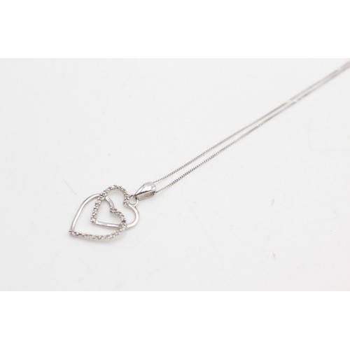 454 - 9ct white gold diamond heart pendant on chain (1.4g)