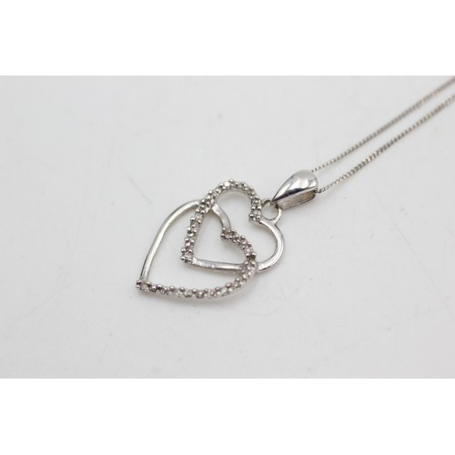 454 - 9ct white gold diamond heart pendant on chain (1.4g)