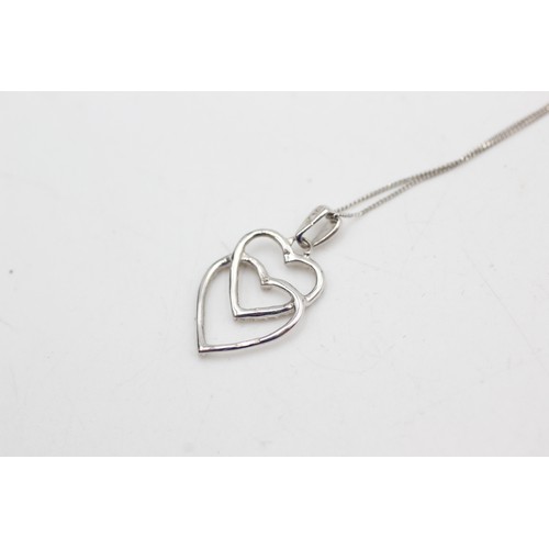 454 - 9ct white gold diamond heart pendant on chain (1.4g)