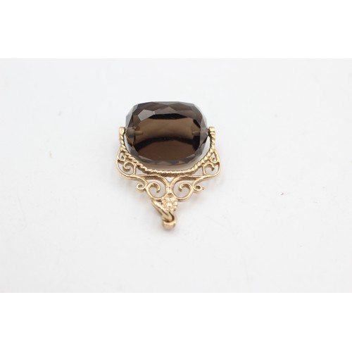 486 - 9ct gold smokey quartz spinner fob (7g)