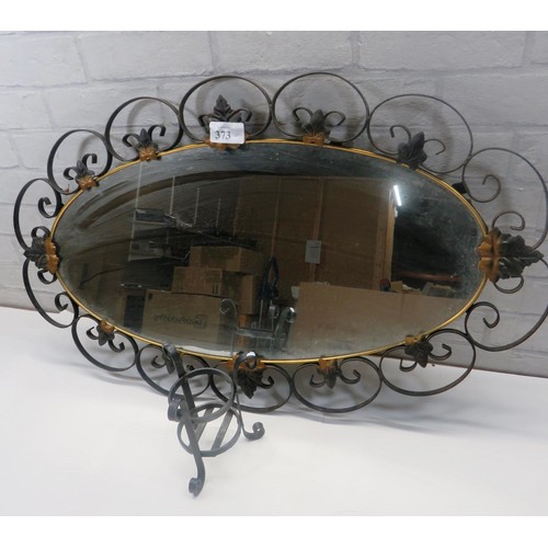 373 - WROUGHT IRON MIRROR WITH LEAVES ON AND WROUGHT IRON CANDLE HOLDER