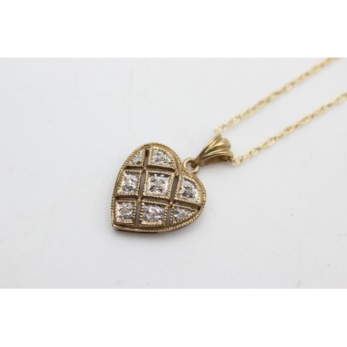 406 - 9ct gold vintage diamond heart pendant on chain (1.8g)