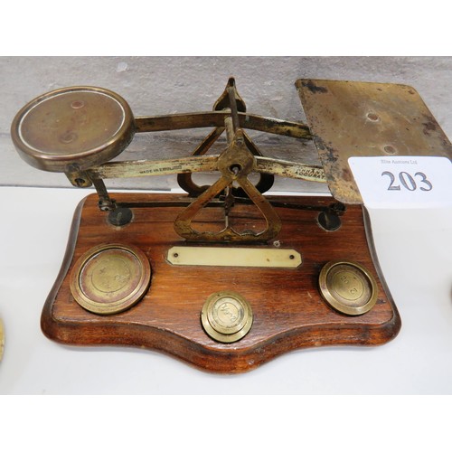 203 - TWO HEAVY BRASS WEIGHTS AND MINIATURE SCALES WITH WEIGHTS