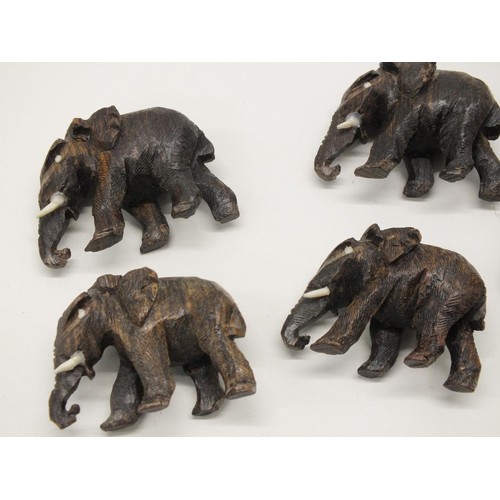 252 - 12 SMALL CARVED WOOD ELEPHANTS