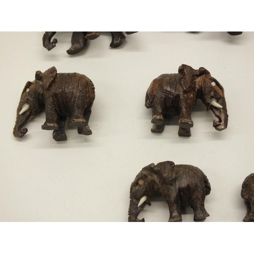 252 - 12 SMALL CARVED WOOD ELEPHANTS