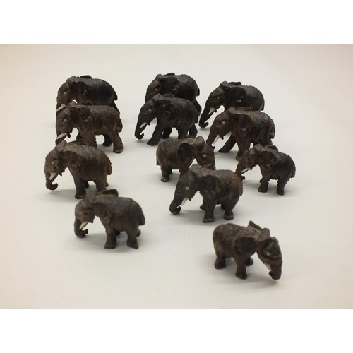 252 - 12 SMALL CARVED WOOD ELEPHANTS