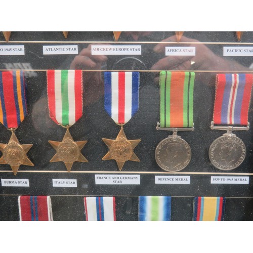 49 - 24 REPRODUCTION MILITARY MEDALS PRESENTED IN A DISPLAY FRAME