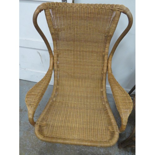 242 - TWO RATTAN ARMCHAIRS AND FOOTSTOOL FOR INDOORS