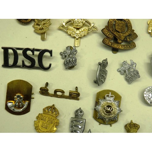 52 - BAG OF MILITARY AND OTHER BADGES