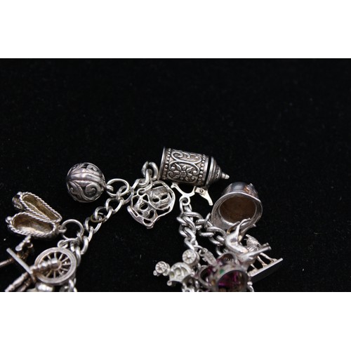 412 - Vintage .925 Sterling Silver CHARM BRACELET inc. Frog, Monument, Crown (66g)