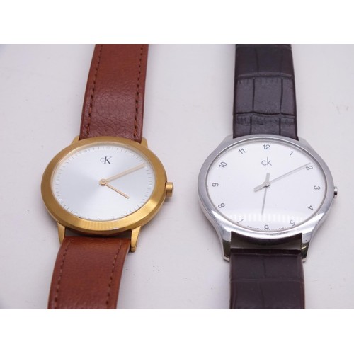 63 - 2 X MENS CALVIN KLEIN WATCHES ON LEATHER STRAPS