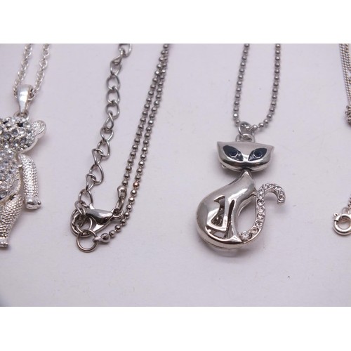 211 - 925 SILVER NECKLACE & TWO WHITE METAL NECKLACES INCLUDES ARTICULATED TEDDY PENDANT