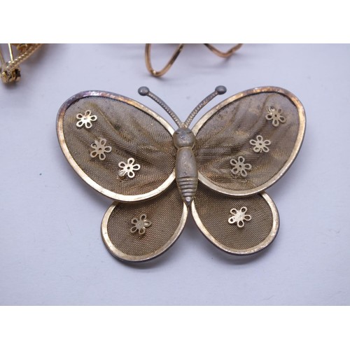 212 - FOUR VINTAGE GOLD TONE BROOCHES INCLUDES FILIGREE WITH PINK CORAL FLOWERS & BUTTERFLY