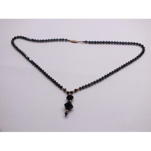 295 - ART DECO BLACK JET HAND FACETED BEAD NECKLACE WITH 9CT GOLD CLASP AND SPACER BEADS