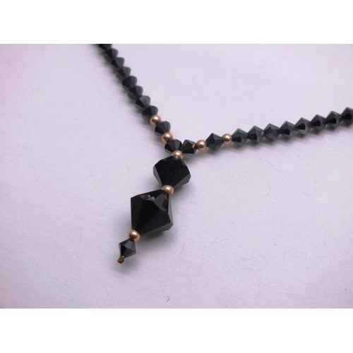 295 - ART DECO BLACK JET HAND FACETED BEAD NECKLACE WITH 9CT GOLD CLASP AND SPACER BEADS