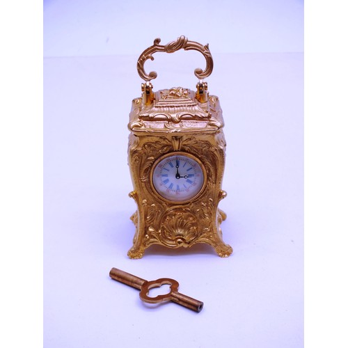 342 - ORNATE GOLD GILT MINIATURE CARRIAGE CLOCK WITH KEY- WORKING - HEIGHT 10CM