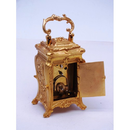 342 - ORNATE GOLD GILT MINIATURE CARRIAGE CLOCK WITH KEY- WORKING - HEIGHT 10CM