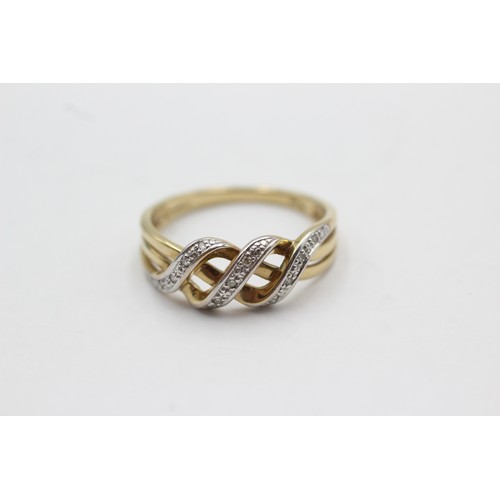 530 - 9ct gold diamond stylised knot ring (2.3g) size S