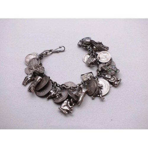 385 - VINTAGE SILVER CHARM BRACELET, 37 CHARMS- WEIGHT 74G