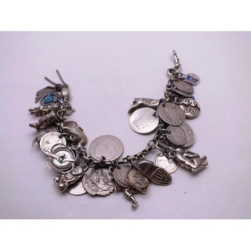 385 - VINTAGE SILVER CHARM BRACELET, 37 CHARMS- WEIGHT 74G