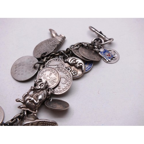 385 - VINTAGE SILVER CHARM BRACELET, 37 CHARMS- WEIGHT 74G