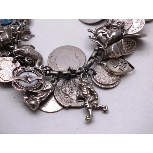 385 - VINTAGE SILVER CHARM BRACELET, 37 CHARMS- WEIGHT 74G