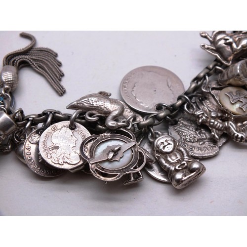 385 - VINTAGE SILVER CHARM BRACELET, 37 CHARMS- WEIGHT 74G