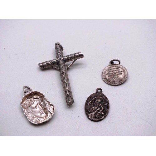 388A - FOUR RELIGEOUS THEMED SILVER PENDANTS