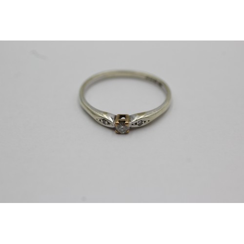 608 - 9ct white gold diamond three stone ring (2g) size R