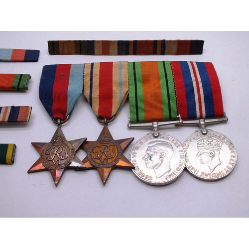 272 - MOUNTED WW2 MEDAL GROUP AND RIBBON BARS INCLUDING AFRICA STAR ETC