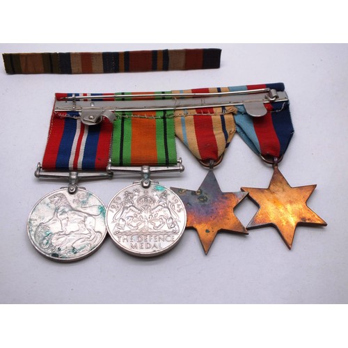 272 - MOUNTED WW2 MEDAL GROUP AND RIBBON BARS INCLUDING AFRICA STAR ETC