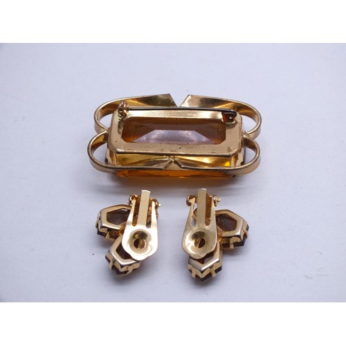 12 - AUSTRIA SIGNED LARGE GOLD TONE AND EMERALD CUT CITRINE GLASS BROOCH AND MATCHING CLIP ON EARRINGS IN... 