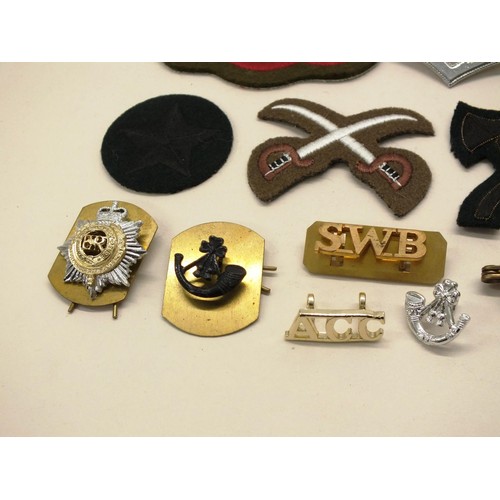 239 - BAG OF VARIOUS MILITARY BADGES