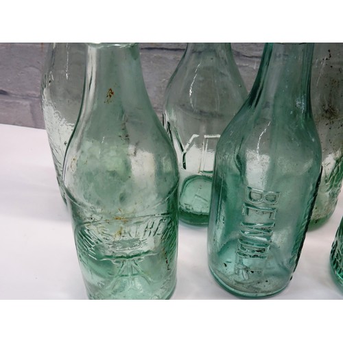 194 - 11 VINTAGE POP BOTTLES