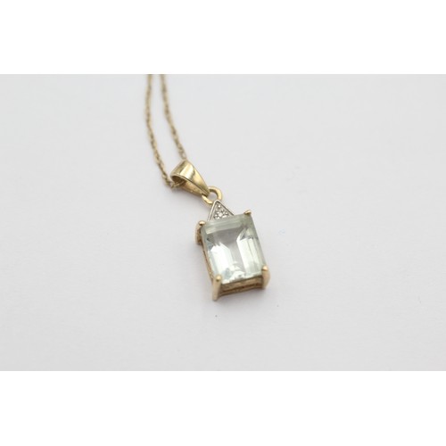 552 - 9ct gold blue quartz & diamond pendant necklace (2.1g) SIZE O