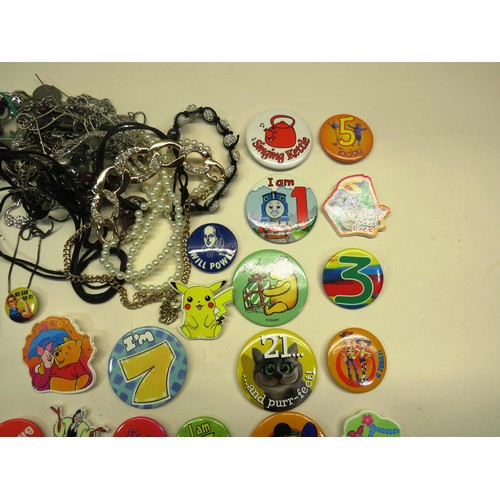 174 - BAG OF JEWELLERY AND OLD BADGES