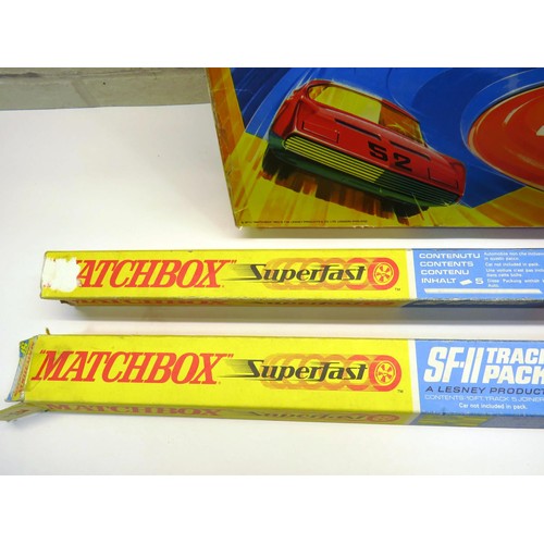 67 - MATCHBOX SUPERFAST COLLECTION TO INCLUDE SUPERBOOSTER, SLIPSTREAM CURVE AND TWO TRACK PADS