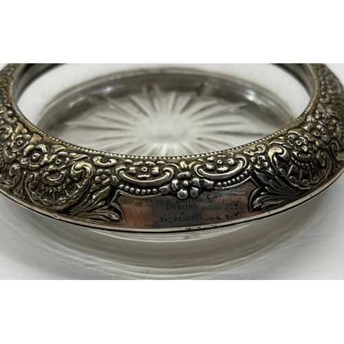 59 - SILVER RIMMED GLASS DISH - MARKED STERLING WITH ORIGINAL WHITE METAL BASE