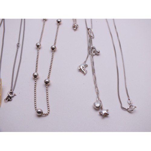 42 - FOUR SILVER NECKLACES