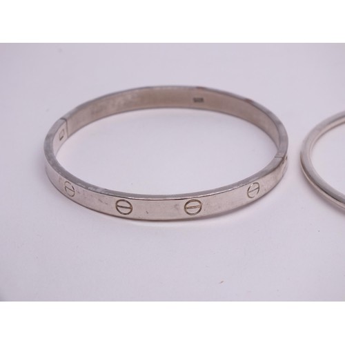 54 - THREE SILVER BANGLES