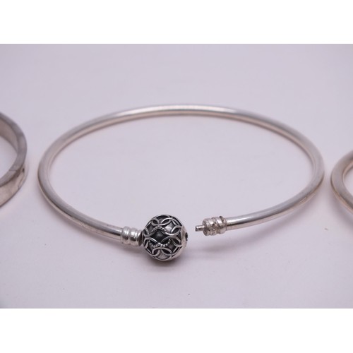 54 - THREE SILVER BANGLES