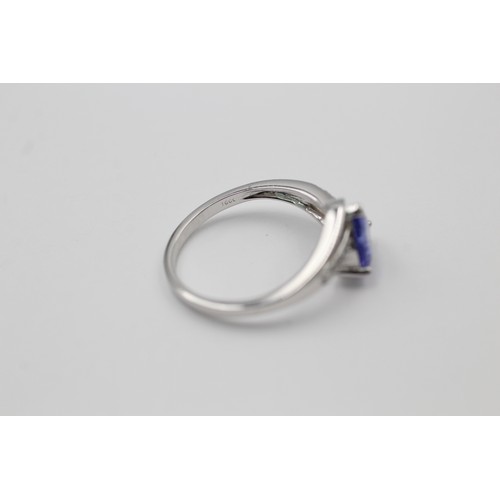 550 - 9ct white gold tanzanite & clear gemstone dress ring (2.3g) SIZE N